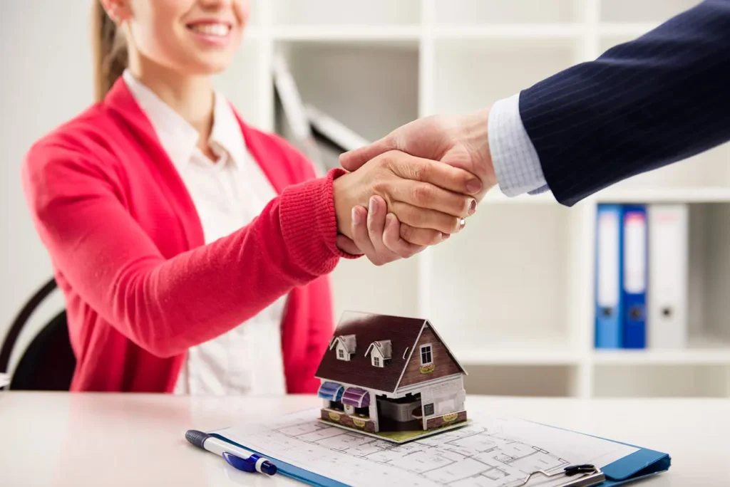 Handshake Over Model House